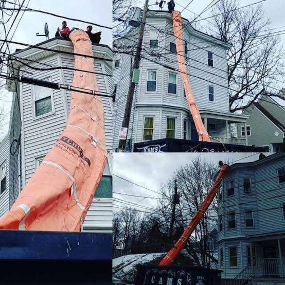 U-Chute reusable demolition debris chute installed on a multi-story construction site