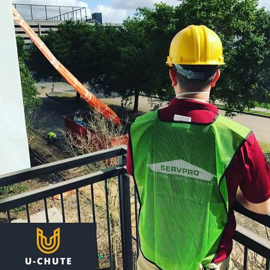 U-Chute debris chute in use on a jobsite